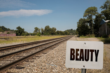 The word beauty on a sign  in nature.