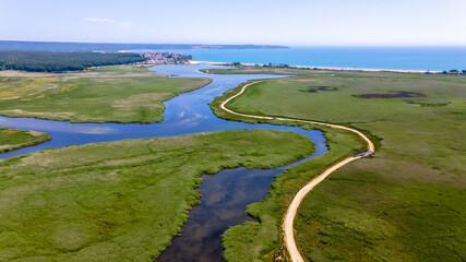 Fototapeta premium Drone view of Mert Lake and Black Sea coast in Igneada. A lake curled through the reeds.