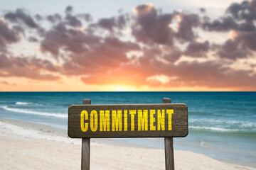 Commitment sign in nature at the beach.