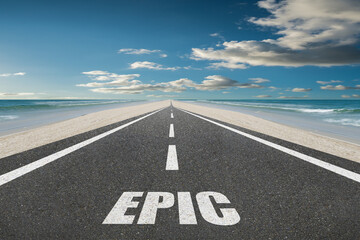 The word Epic on a highway leading into the sunset at the beach.