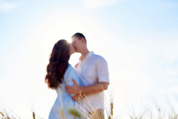 Awesome happy couple have fun in a field sunset background. Lifestyle and travel concept