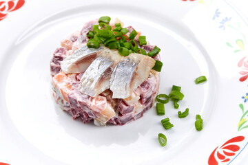 herring salad on the white background