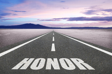 The word Honor on a road leading to the horizon for nobility concept.