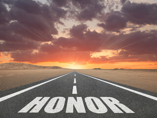 The word Honor on a road leading to the horizon for nobility concept.