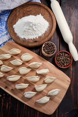 raw dumplings on the wooden board