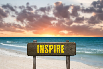 Inspire sign at a beautiful beach.