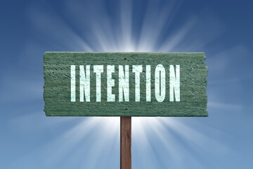 Intention sign on blue background for motivational concept.