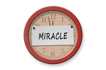 Miracle written on a note on a bulletin board.