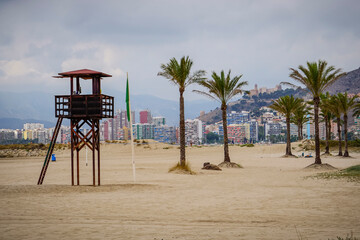 Panoramic view of the castle of the city of Cullera with the beach and the lifeguard tower in the foreground