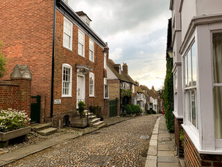 Mermaid street view. Old cozy medieval tudor half-timbered house cottage. Summer in Rye. High street view in Rye, East Sussex, England. Charming medieval town. Architecture, cozy popular touristic des