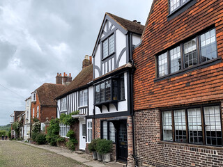 Fototapeta na wymiar Watchbell street view in Rye East Sussex Charming medieval place in old town Picturesque countryside. East Sussex, England. Charming medieval town. Architecture, cozy popular touristic destination. 
