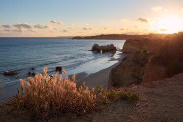 Beautiful sunset over the Praia dos Careanos and Alvor. Algarve, Portugal