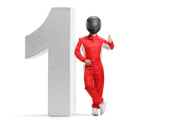 Racer in a red suit and black helmet leaning on number one and gesturing a thumb up sign