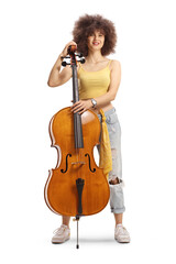 Young female musician standing with a contrabass and smiling