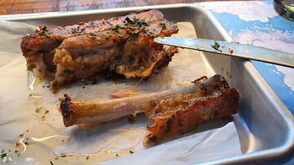 Delicious fried ribs sprinkled with herbs