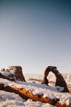 Snowy arch landscape in Utah