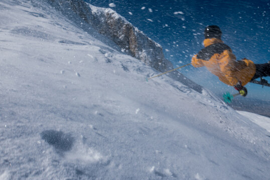 Man skiing falling out of the frame