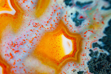 Agate stone natural abstraction background or wallpaper. Super macro small parts in the bend of the edge of the agate mineral. - obrazy, fototapety, plakaty