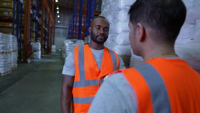 Business concept of 4k Resolution. Employees are talking in the warehouse.