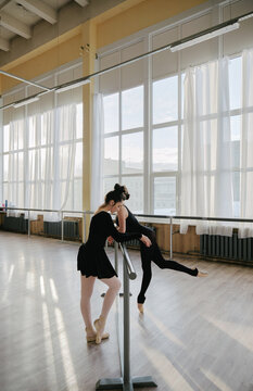 two ballerinas rehearse in the hall 