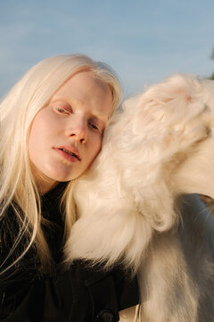 Albino girl with a dog
