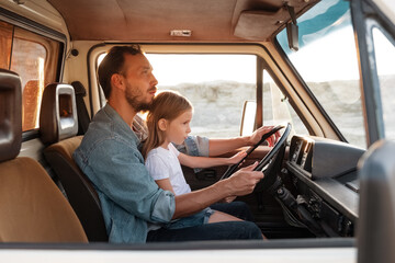 Dad with child driving van