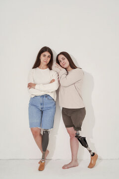 Handicapped women leaning on wall