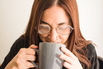 Woman drinking hot tea