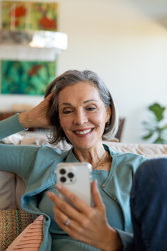 Relaxed Woman Smiles While Video Chatting