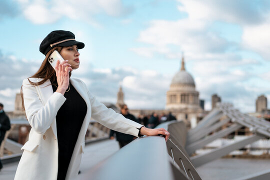 Woman using her smartphone to call during a tour in London