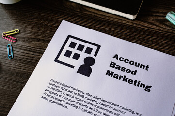 There is dummy documents that created for the photo shoot on the desk about Account Based Marketing.