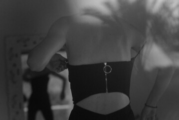 A woman in front of a mirror