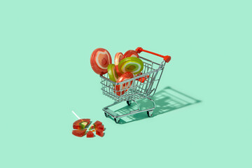 Shopping trolley full of delicious colorful lollipop