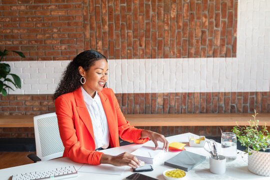 Elegant project manager working at office desk