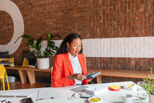 Elegant businesswoman enveloping invitations