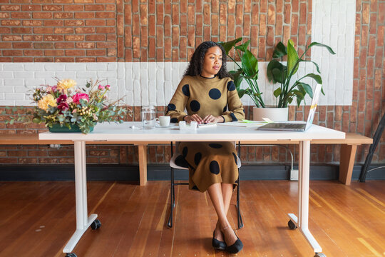 Mixed woman working in event reception