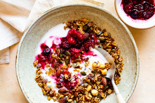 Healthy granola with nuts, seeds and kefir milk