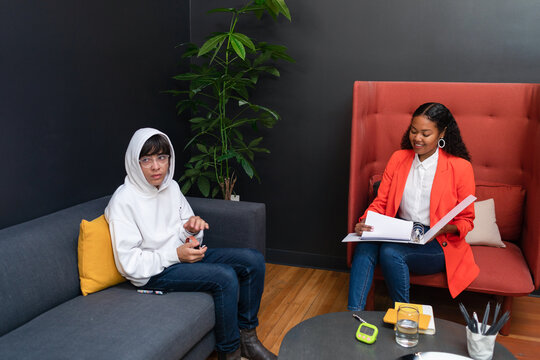 Psychologist in private session with teenage student