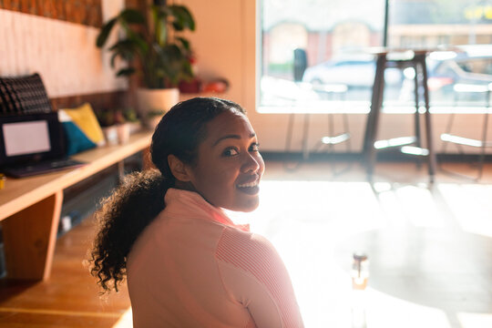 Portrait of happy woman exercising from work