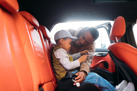 Man and Little Boy in Car