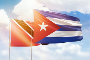 Sunny blue sky and flags of cuba and trinidad and tobago