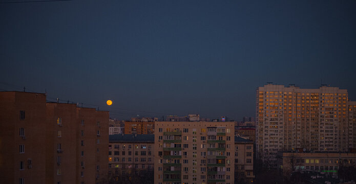 Calm Cityscape Panorama With Moon Rise