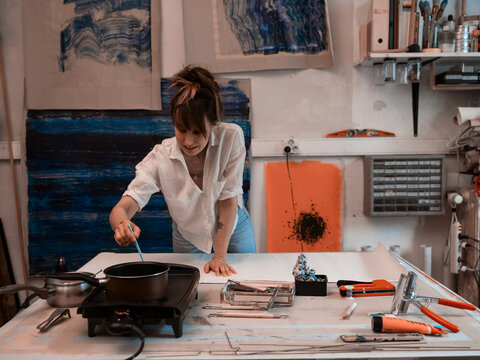 Redhead young women working in modern craft atelier horizontal