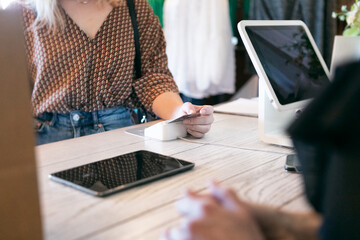 Boutique: Woman Inserts Credit Card To Pay Clerk