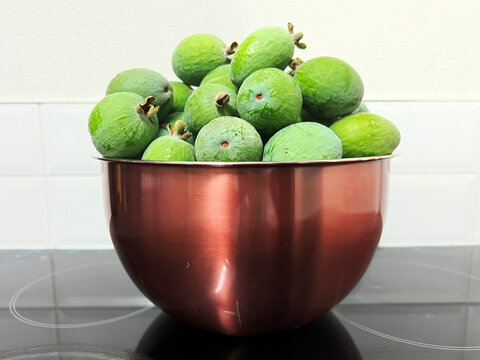 Feijoas in copper bowl