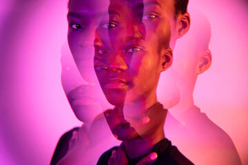 Multiple Portrait Of A Woman Under Coloured Gel Lights.