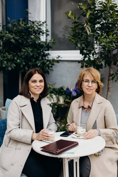 portrait od Female colleagues having coffee break