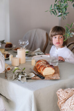 Child sitting at festive Easter table