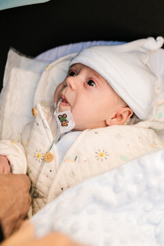 Cute Baby With Oral Feeding Tube Lying In Stroller