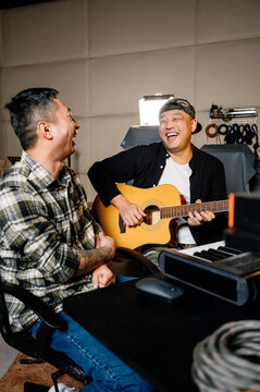 Two men making music in studio